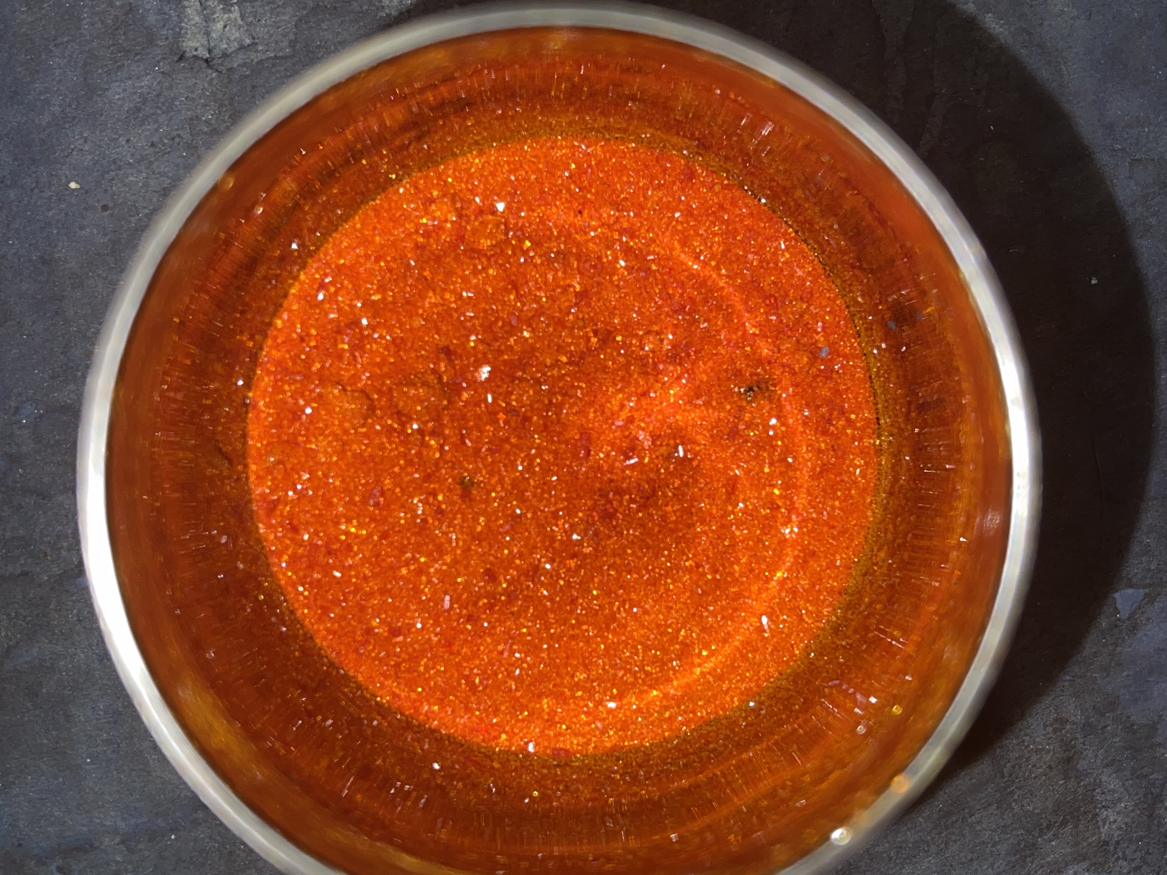 image of a sparkly red chemical